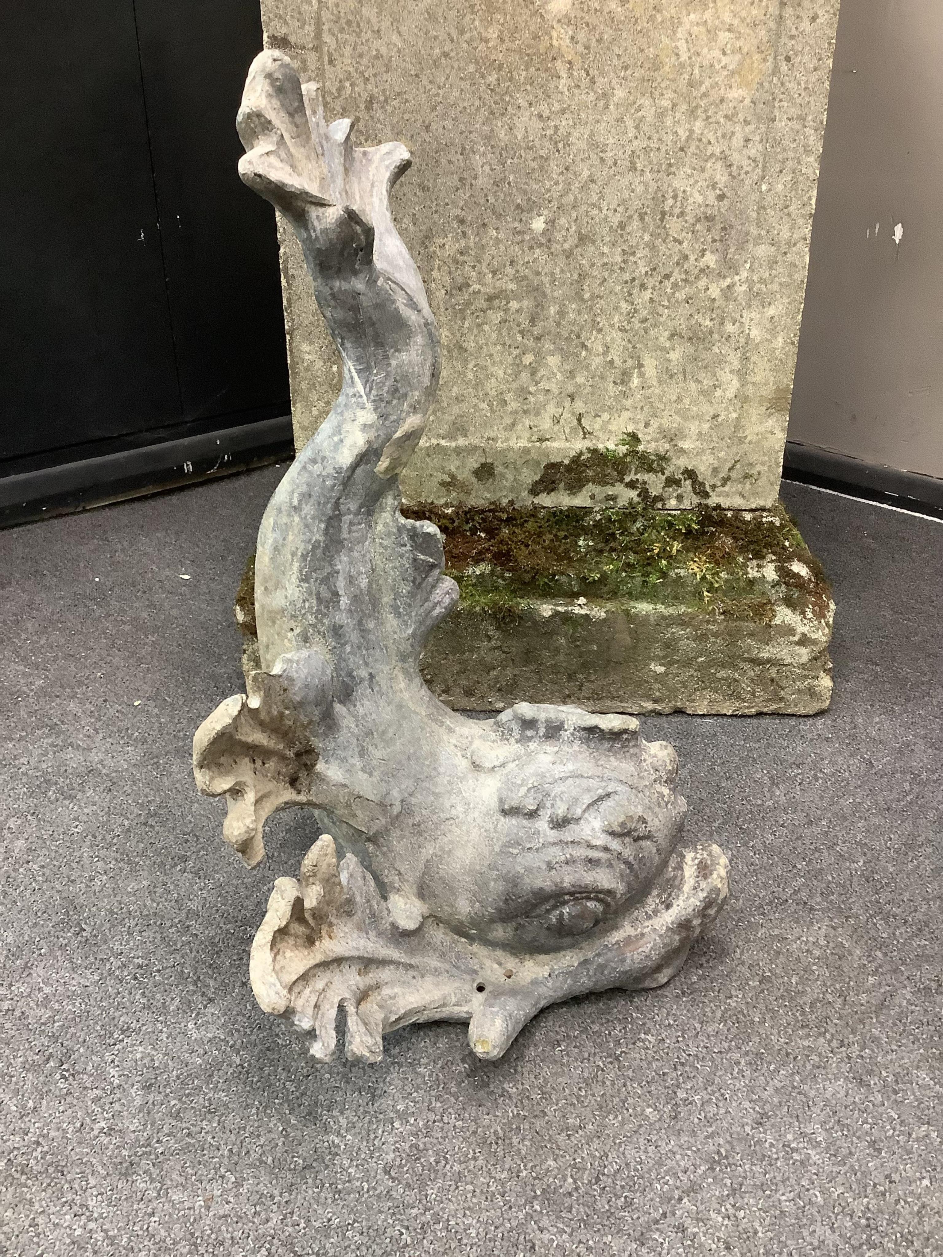 A 19th century lead dolphin fountain head, height 48cm. Condition - fair